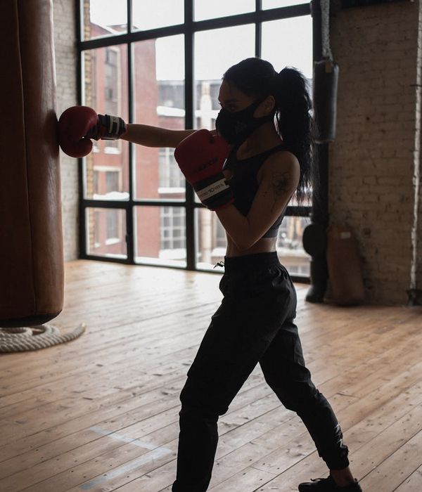 Man focused during a floor exercise, showing concentration and poise.